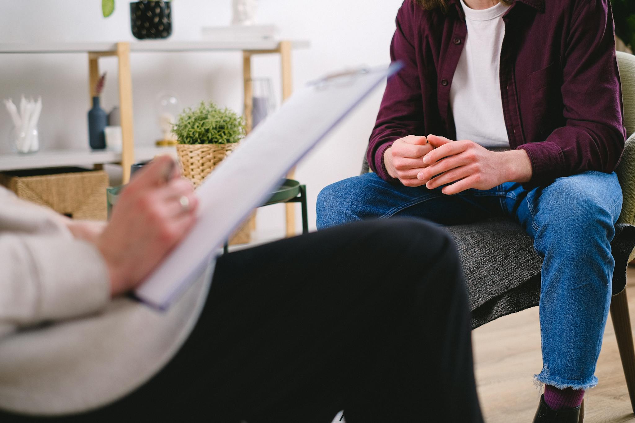 Therapist and client discussing issues in a psychotherapy session, highlighting mental health support.